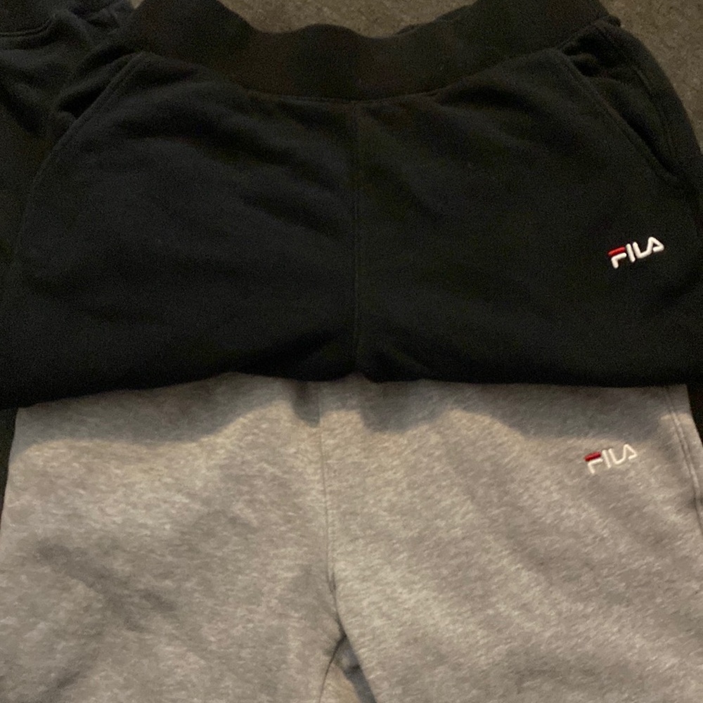 two pairs of fila sweatpants